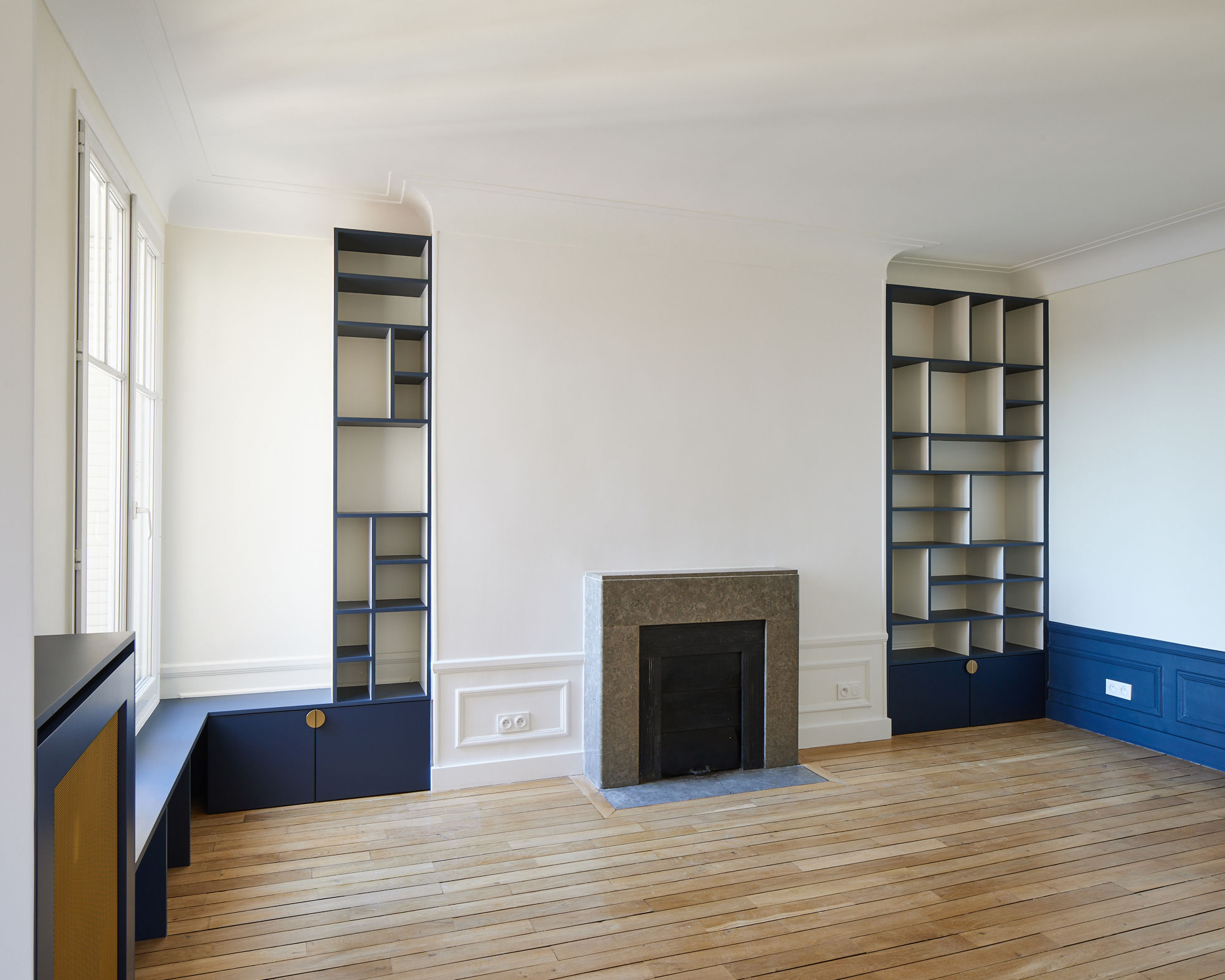 Rénovation appartement salon bibliothèques sur mesure